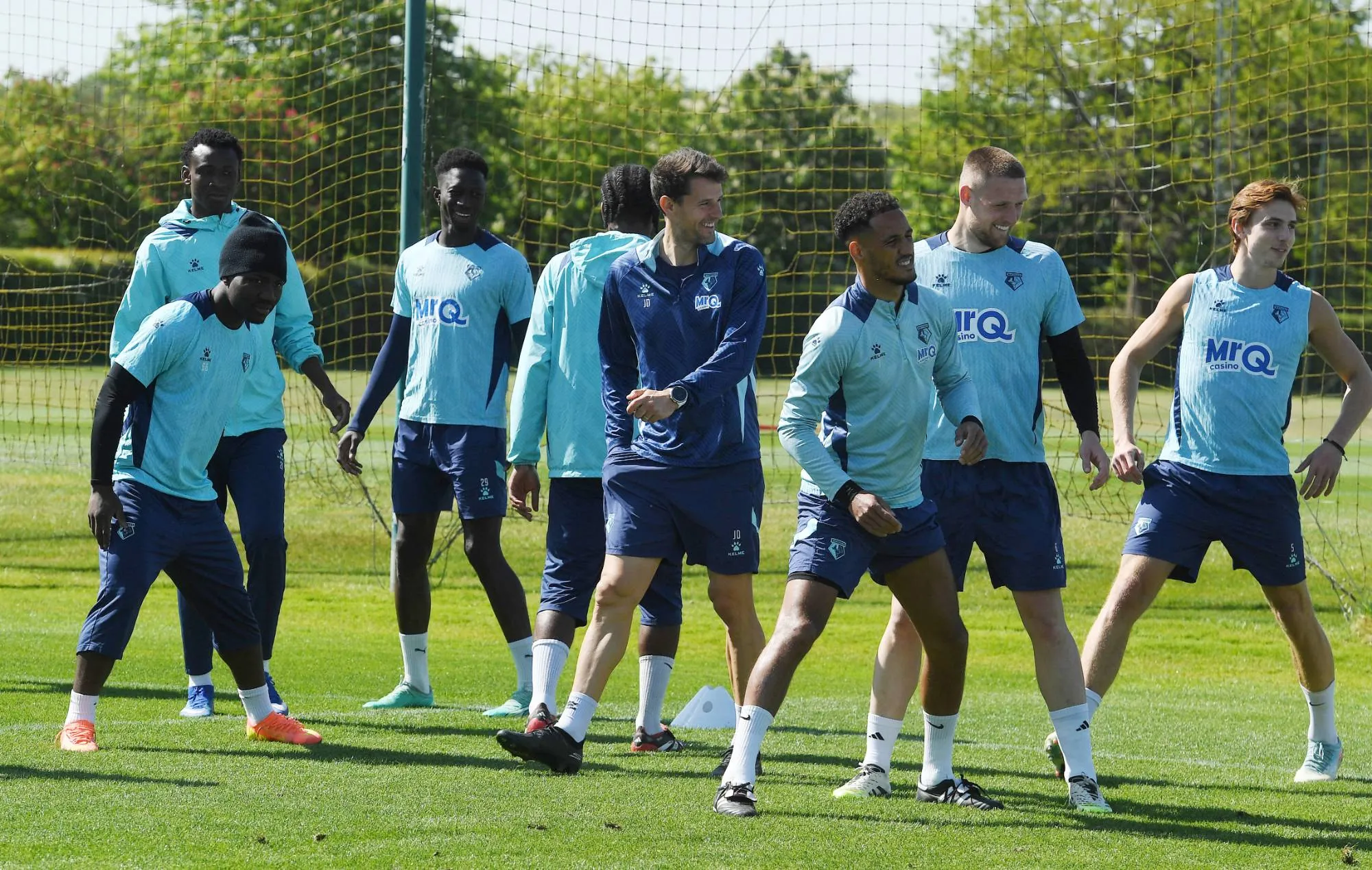 Joel Donés with Watford FC players during a training session